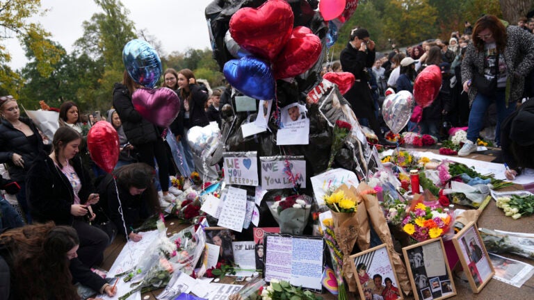 Fans gather near the Peter Pan statue in Hyde Park.