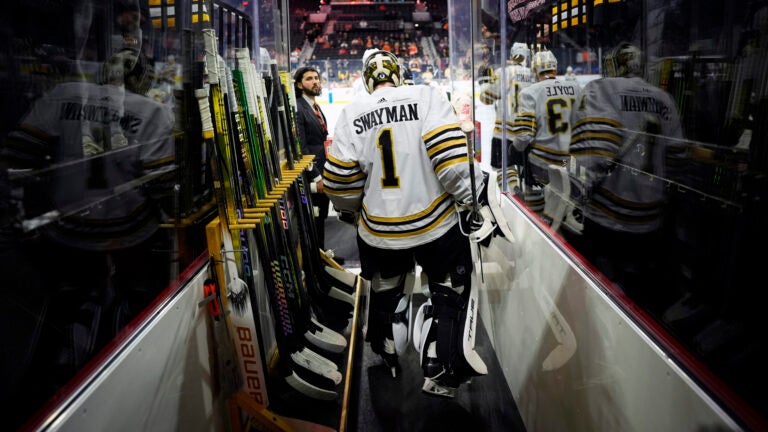 Boston Bruins' Jeremy Swayman walks to the ice before an NHL hockey game against the Philadelphia Flyers, Saturday, March 23, 2024, in Philadelphia.