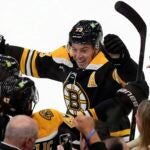 Boston Bruins' Charlie McAvoy (73) celebrates the goal by Mark Kastelic (47) during the first period of an NHL hockey game against the Montreal Canadiens, Thursday, Oct. 10, 2024, in Boston.