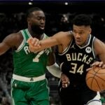 Milwaukee Bucks' Giannis Antetokounmpo gets past Boston Celtics' Jaylen Brown during the second half of an NBA basketball game Tuesday, April 9, 2024, in Milwaukee. The Bucks won 104-91.