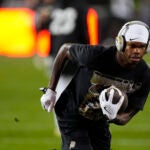 Colorado wide receiver Travis Hunter (12) warms up before an NCAA college football game Saturday, Oct. 26, 2024, in Boulder, Colo.