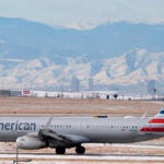 FILE - An American Airlines jetliner rumbles down a runway at Denver International Airport, Jan. 16, 2024, in Denver.