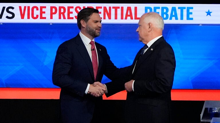 Republican vice presidential nominee Sen. JD Vance, R-Ohio, left, and Democratic vice presidential nominee Minnesota Gov. Tim Walz, shake hands as they arrive for a CBS News vice presidential debate, Tuesday, Oct. 1, 2024, in New York.