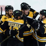 Bruins center Mark Kastelic (47), center Johnny Beecher (19), defenseman Mason Lohrei (6) and left wing Cole Koepke (45) celebrate Kastelic’s goal against the Florida Panthers during the first period at TD Garden.