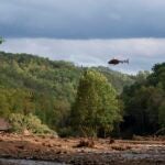 A helicopter takes off in the aftermath of Hurricane Helene on September 30, 2024 near Black Mountain, North Carolina.
