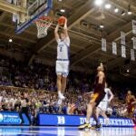 Cooper Flagg dunks during an exhibition game against Arizona State.