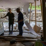 FEMA employee Jirau Alvaro works with Daniel Mancini, doing a report on the damage to his property on Sunday, Oct. 6, 2024 in rural Buncombe County, near Black Mountain, N.C.