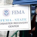 People gather at a FEMA Disaster Recovery Center at A.C. Reynolds High School in Asheville, N.C.,, Tuesday, Oct. 15, 2024.