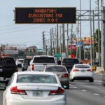 Highway signage announces the impending arrival of Hurricane Milton and the evacuations zones on Tuesday, Oct. 8, 2024, in Port Richey, Fla.