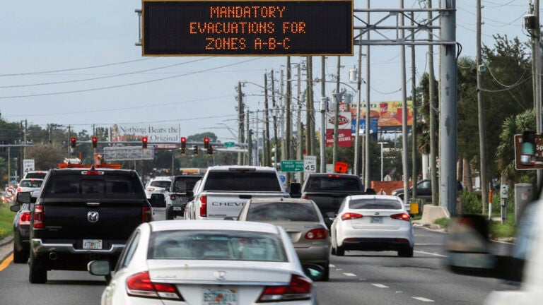 Highway signage announces the impending arrival of Hurricane Milton and the evacuations zones on Tuesday, Oct. 8, 2024, in Port Richey, Fla.