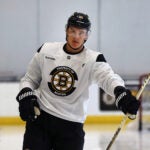 The Bruins training camp continued on Thursday at Warrior Ice Arena. Nikita Zadorov spins his stick during warmups.