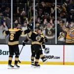 BOSTON, MASSACHUSETTS - OCTOBER 26: Brad Marchand #63 of the Boston Bruins reacts after scoring game winning goal against the Toronto Maple Leafs during an overtime period at the TD Garden on October 26, 2024 in Boston, Massachusetts.