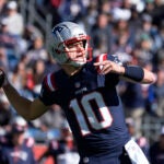 Drake Maye passes the ball in a game against the Jets.