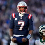 New England Patriots quarterback Jacoby Brissett (7) celebrates after Patriots running back Rhamondre Stevenson ran for a touchdown in the second half of an NFL football game against the New York Jets, Sunday, Oct. 27, 2024, in Foxborough, Mass.