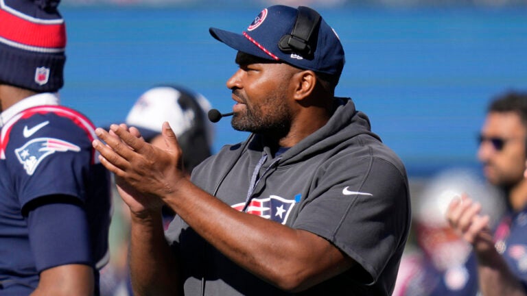 Jerod Mayo applauds from the sidelines.