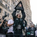 Sabrina Ionescu holds the WNBA championship trophy during the Liberty's parade.