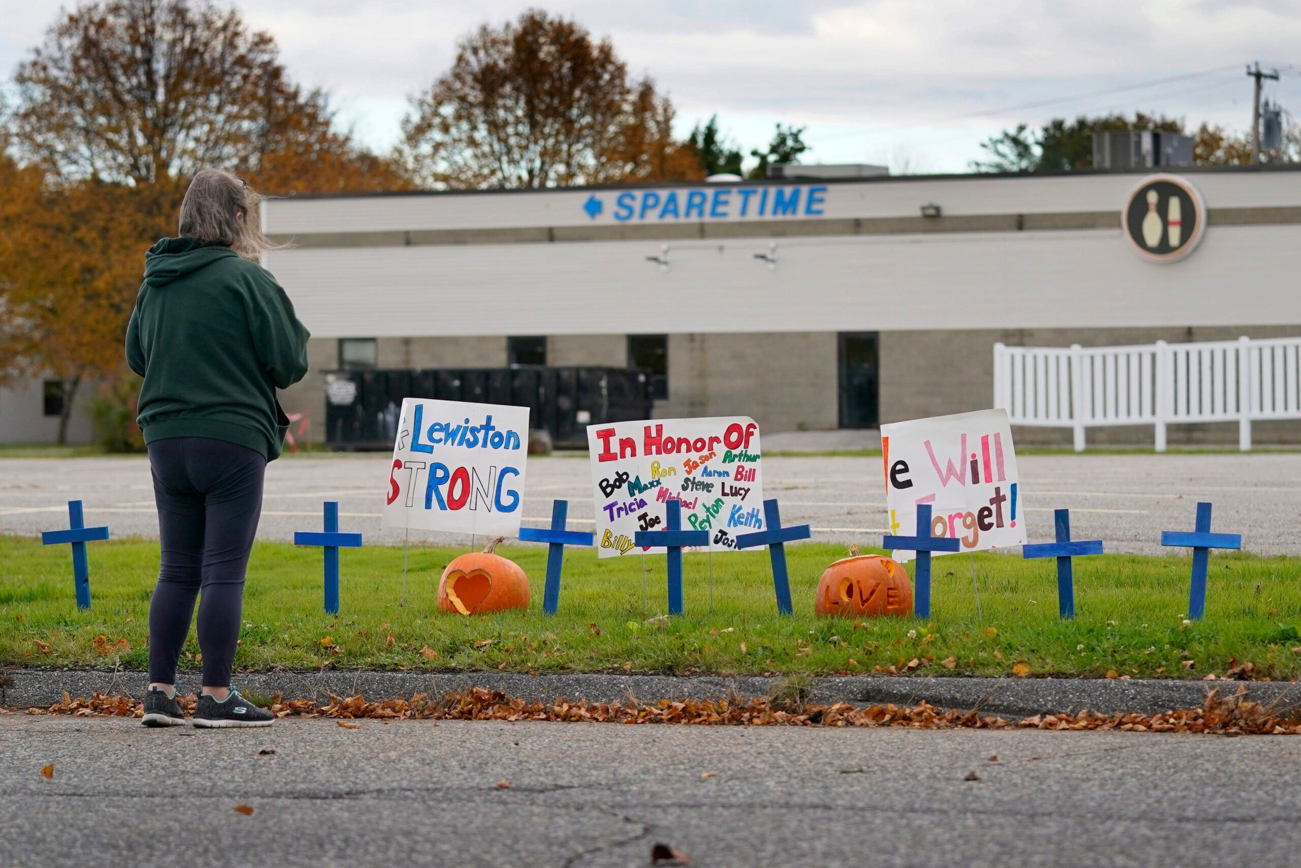 A makeshift memorial outside Sparetime Bowling Alley, the site of the mass shooting, in Lewiston, Maine.