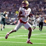 Boston College wide receiver Lewis Bond runs into the end zone to score during a game against Michigan State.