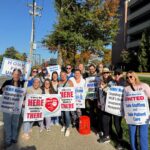 Newton-Wellesley Hospital nurses picket outside the hospital on the day of their strike authorization vote.