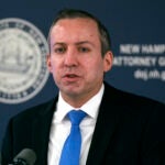 New Hampshire Attorney General John Formella addresses reporters during a news conference, Jan. 25, 2024, in Concord, N.H.