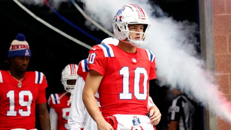 New England Patriots quarterback Drake Maye (10) walks onto the field to face the Houston Texans at Gillette Stadium.