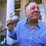 Richard Schiffer Jr., who faces witness intimidation and other charges related to the Karen Read case, holds a duck as he greets greets supporters on the steps outside Stoughton District Court following his arraignment, Wednesday, Oct. 23, 2024 in Stoughton, Mass.