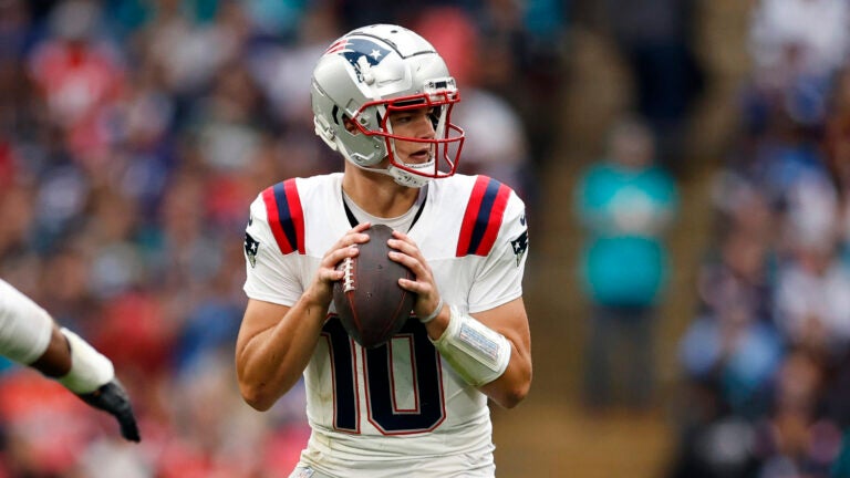 London, England – 10/20/24 – New England Patriots quarterback Drake Maye (10) looks to throw against the Jacksonville Jaguars in the second quarter at Wembley Stadium.