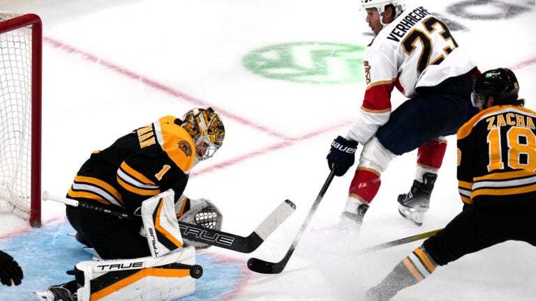 Bruins goaltender Jeremy Swayman makes a save on a shot by Florida Panthers center Carter Verhaeghe during the first period.