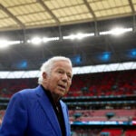 Robert Kraft walks on the Wembley Stadium field before a game against the Jaguars.