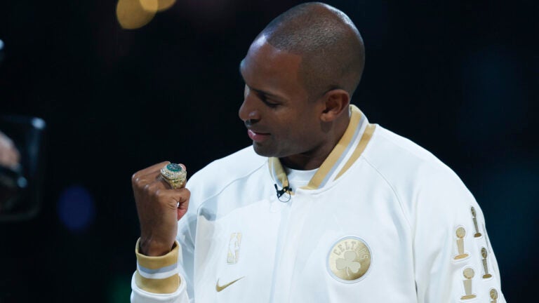 Boston Celtics center Al Horford looks at his ring during the NBA championship ring ceremony at TD Garden.