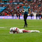 Jacksonville Jaguars cornerback Ronald Darby (25) celebrates as New England Patriots wide receiver Ja'Lynn Polk (1) reacts after slipping and not catching a two-point conversion attempt during the fourth quarter at Wembley Stadium.