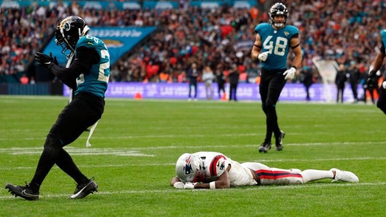 Jacksonville Jaguars cornerback Ronald Darby (25) celebrates as New England Patriots wide receiver Ja'Lynn Polk (1) reacts after slipping and missing a two-point conversion attempt in the fourth quarter at Wembley Stadium caught.