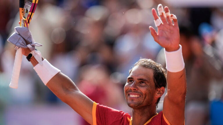 Rafael Nadal celebrates his victory over Marton Fucsovics during the men's singles tennis competition at the 2024 Summer Olympics.