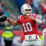 New England Patriots quarterback Drake Maye (10) looks to pass the ball as offensive tackle Demontrey Jacobs (75) defends during the second half of an NFL football game against the Houston Texans, Sunday, Oct. 13, 2024, in Foxborough, Mass.