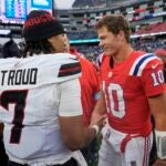 New England Patriots quarterback Drake Maye (10) and Houston Texans quarterback C.J. Stroud (7) meet on the field following an NFL football game, Sunday, Oct. 13, 2024, in Foxborough, Mass.