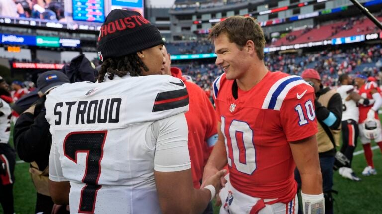 New England Patriots quarterback Drake Maye (10) and Houston Texans quarterback C.J. Stroud (7) meet on the field following an NFL football game, Sunday, Oct. 13, 2024, in Foxborough, Mass.