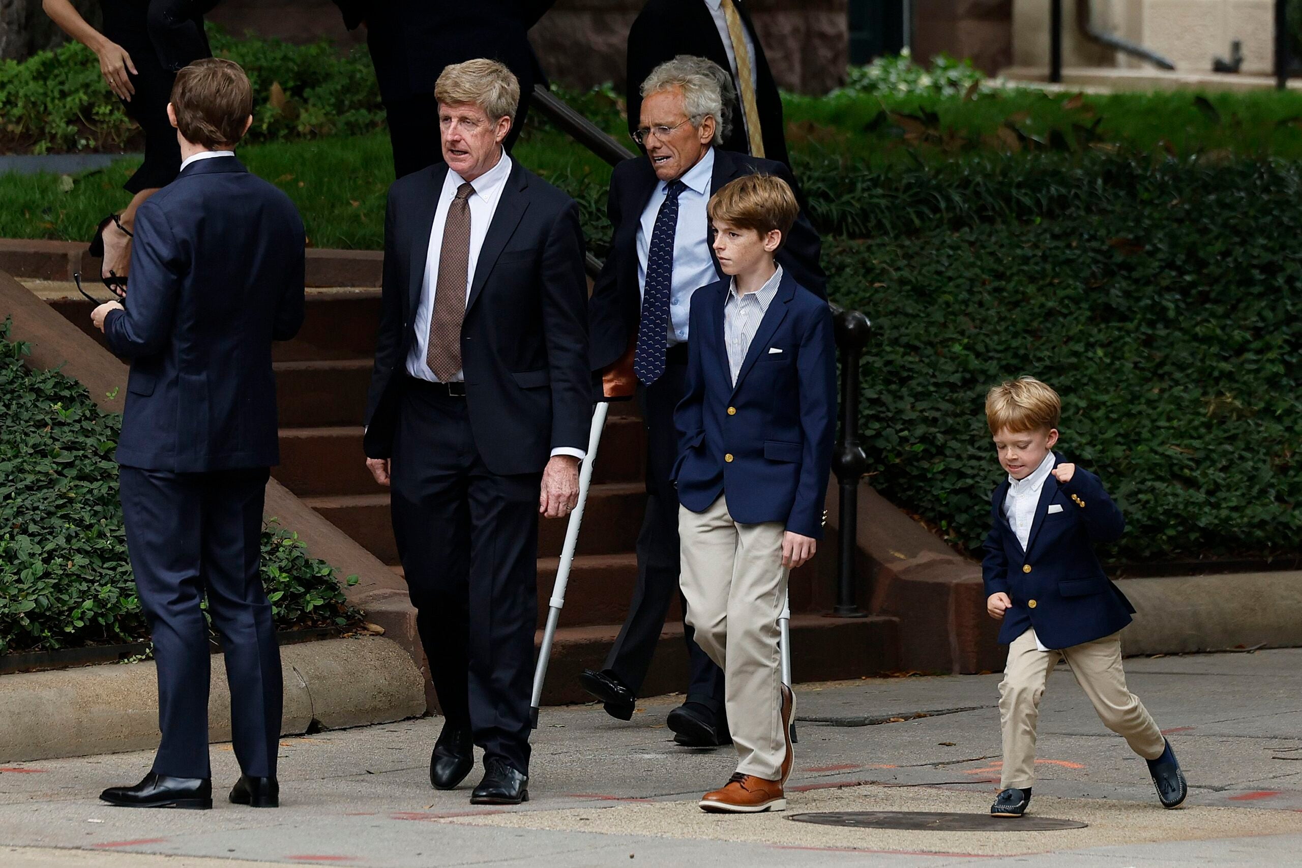 Members of Ethel Kennedy's family, including nephew Patrick Kennedy (2nd L) and her son Joseph P. Kennedy II (3rd L), gather outside the Cathedral of Saint Matthew for her celebration of life on October 16, 2024 in Washington, DC.