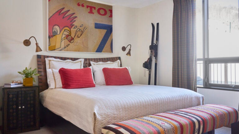 Designer Michelle Holland splashed the home with shades of blue, red, and mustard to combat the gray of a Vermont winter.