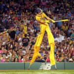 Savannah Bananas Dakota “Stilts” Albritton hits the ball at Fenway Park.