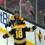 Bruins Tyler Johnson, (90), and Boston Bruins center Pavel Zacha (18) celebrate after Jonson scored what turned out to be the game winner during the third period.