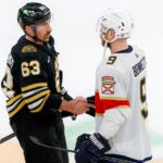 Boston Bruins left wing Brad Marchand (63) shaking hands with Florida Panthers center Sam Bennett (9) after their 2-1 loss during game six in the Eastern Conference NHL second round Playoff game at TD Garden.