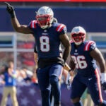 New England Patriots Ja’Whaun Bentley celebrates after sacking New Orleans Saints Derek Carr during first quarter NFL action at Gillette Stadium.