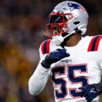 New England Patriots linebacker Josh Uche (55) celebrates a defensive play in the second half at Acrisure Stadium. The Patriots defeat the Steelers, 21-18.
