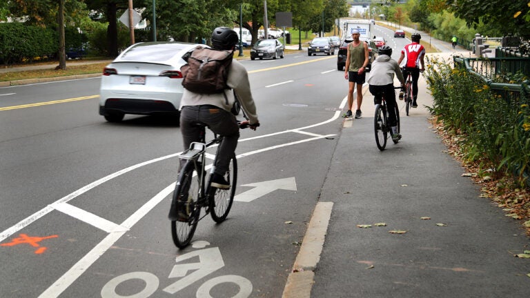 A bicyclist died after being struck by a vehicle on Memorial Drive eastboundnear the BU Bridge where the designated bike lane ends at a sidewalk.