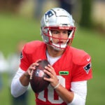 The NE Patriots practiced at the Gillette Stadium practice field. Qb Drake Maye looks to pass during a drill.