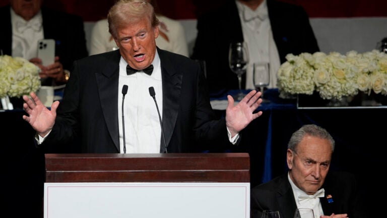 Republican presidential nominee former President Donald Trump speaks as Senate Majority Leader Chuck Schumer of N.Y., listens at the 79th annual Alfred E. Smith Memorial Foundation Dinner, Thursday, Oct. 17, 2024, in New York.