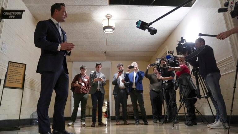America PAC lawyer Chris Gober speaks with members of the media ahead of a hearing at a City Hall courtroom in Philadelphia.