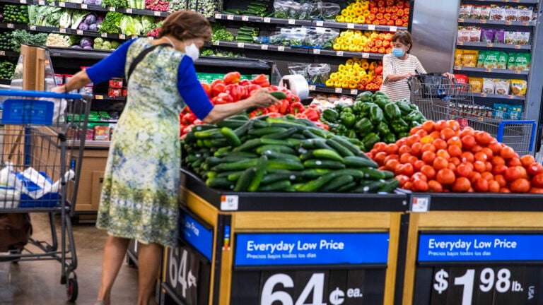 People buy groceries at a Walmart Superstore in Secaucus, New Jersey.