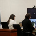 Jason Eaton is seen on a monitor.