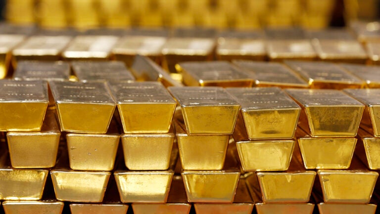 Gold bars are shown stacked in a vault at the United States Mint.